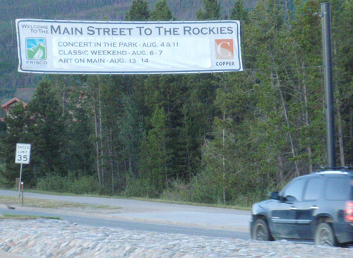 sign announcing a parade of Classic Cars.